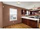 Traditional kitchen with wood cabinets, white countertops, and a bright window at 539 Deer Trail Dr, Indianapolis, IN 46217