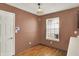 Kitchen nook featuring wood floors, a white door, a window, and neutral paint at 539 Deer Trail Dr, Indianapolis, IN 46217