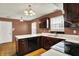 Traditional kitchen featuring wood cabinets, white countertops, an island, and stainless steel appliances at 539 Deer Trail Dr, Indianapolis, IN 46217