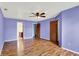 Large main bedroom with wood-look floors, two closets, and attached bath at 539 Deer Trail Dr, Indianapolis, IN 46217