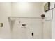 Utility room with storage shelf and access to electrical and plumbing at 539 Deer Trail Dr, Indianapolis, IN 46217