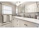 Bright bathroom with double sink vanity, marble countertop, and storage at 5415 Kilmer Ln, Indianapolis, IN 46250