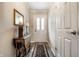 Inviting entryway with a classic rug, neutral walls, and a view of the front door at 5415 Kilmer Ln, Indianapolis, IN 46250