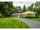 Well-maintained brick home features a lush lawn and a paved driveway, offering an attractive exterior at 5415 Kilmer Ln, Indianapolis, IN 46250
