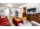 Stylish living room with an open floor plan, hardwood floors, and access to the kitchen at 5415 Kilmer Ln, Indianapolis, IN 46250