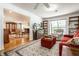 Comfortable living room with classic built-ins and hardwood floors, perfect for relaxation at 5415 Kilmer Ln, Indianapolis, IN 46250