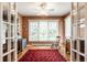 Cozy sunroom with hardwood floors, natural light, and neutral walls at 5415 Kilmer Ln, Indianapolis, IN 46250