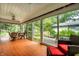 Sunroom with tile flooring, ceiling fan, and sliding glass doors to the backyard at 5415 Kilmer Ln, Indianapolis, IN 46250
