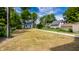 Open backyard featuring small building and long sidewalk at 5682 Broadway St, Indianapolis, IN 46220
