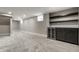 Finished basement space features plush carpeting, a beverage center, and ample room for recreation and entertainment at 5682 Broadway St, Indianapolis, IN 46220