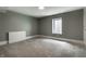Finished basement with carpet flooring, a window, and neutral colored walls at 5682 Broadway St, Indianapolis, IN 46220