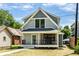 Beautiful craftsman home with inviting front porch and manicured lawn at 5682 Broadway St, Indianapolis, IN 46220