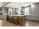 Spacious kitchen with a large island, stainless steel appliances, and stylish pendant lighting at 5682 Broadway St, Indianapolis, IN 46220