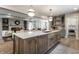 Open concept kitchen showcasing an expansive island, modern finishes, and seamless flow into living spaces at 5682 Broadway St, Indianapolis, IN 46220