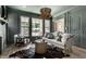 Comfortable living room features decorative lighting, ample seating, and large windows at 5682 Broadway St, Indianapolis, IN 46220
