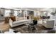 Cozy living room connected to the kitchen and dining area, showcasing neutral tones and elegant decor at 5682 Broadway St, Indianapolis, IN 46220