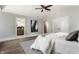 Light and airy main bedroom features ensuite bathroom access, a ceiling fan and ample space at 5682 Broadway St, Indianapolis, IN 46220
