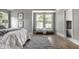 Relaxing main bedroom features natural light and connects to an ensuite bathroom creating a serene retreat at 5682 Broadway St, Indianapolis, IN 46220