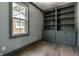 Office with built in cabinets and light hardwood flooring at 5682 Broadway St, Indianapolis, IN 46220