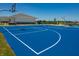 Community basketball court with a blue surface and hoops at 6031 Madera Dr, Whitestown, IN 46075