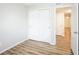 Neutral bedroom featuring wood-look flooring and a closet with sliding doors at 6121 Jester Ct, Indianapolis, IN 46254