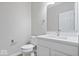 Bright bathroom featuring a white vanity with a modern sink and fixtures at 6528 Abby Ln, Zionsville, IN 46077