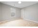 Bright bedroom with neutral walls and plush carpeting, offering a serene atmosphere at 6528 Abby Ln, Zionsville, IN 46077