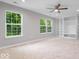 Spacious bedroom with large windows, a ceiling fan, and built in shelving at 6528 Abby Ln, Zionsville, IN 46077