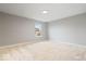 Spacious bedroom featuring a window for natural light and neutral-toned walls at 6528 Abby Ln, Zionsville, IN 46077
