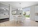 Bright dining area with a sliding door and views to the cozy living room at 6528 Abby Ln, Zionsville, IN 46077