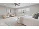 Spacious main bedroom featuring a ceiling fan, plush carpet, and large windows at 6528 Abby Ln, Zionsville, IN 46077