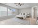 Bright bedroom features large windows, neutral decor, and plush carpet at 6528 Abby Ln, Zionsville, IN 46077