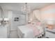 Charming bedroom featuring a crystal chandelier, striped accent wall, and pink decorative accents at 6868 Jacone Dr, Brownsburg, IN 46112