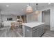 Stylish kitchen with a large island and seating open to the dining and living area at 6868 Jacone Dr, Brownsburg, IN 46112