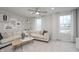 Cozy living area with a comfortable sectional sofa, neutral colors, and large windows for natural light at 6868 Jacone Dr, Brownsburg, IN 46112