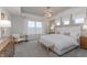Bright main bedroom with tray ceilings, abundant natural light, and elegant furnishings at 6868 Jacone Dr, Brownsburg, IN 46112