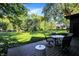 Outdoor seating on a deck with a view of the spacious, green backyard at 710 N Spring St, Greenfield, IN 46140