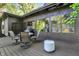 Relaxing outdoor seating on the back deck with views of the lush backyard at 710 N Spring St, Greenfield, IN 46140