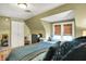 Bedroom featuring hardwood floors, seating area, a closet and queen size bed at 710 N Spring St, Greenfield, IN 46140