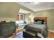 Cozy bedroom featuring a daybed with a view to a window, and a queen size bed at 710 N Spring St, Greenfield, IN 46140