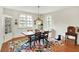 Charming dining room with a wood table, vintage cabinet, and a decorative rug on hardwood floors at 710 N Spring St, Greenfield, IN 46140