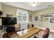 Bright exercise room with a window and desk at 710 N Spring St, Greenfield, IN 46140