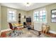 Bright exercise room with two windows, rowing machine, desk and decor at 710 N Spring St, Greenfield, IN 46140