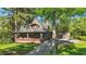 Charming home featuring a covered porch with brick accents and attached two-car garage at 710 N Spring St, Greenfield, IN 46140