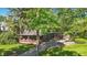 Charming home featuring a covered porch with brick accents and attached two-car garage at 710 N Spring St, Greenfield, IN 46140