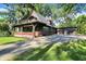 Attractive craftsman-style home with a spacious porch, a balcony, and a detached garage at 710 N Spring St, Greenfield, IN 46140