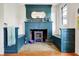 Charming blue painted brick fireplace with decor at 710 N Spring St, Greenfield, IN 46140
