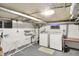 Functional laundry area with washer, dryer, sink, and window for ventilation at 710 N Spring St, Greenfield, IN 46140
