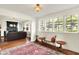 Cozy living room with hardwood floors, many windows, and an open layout at 710 N Spring St, Greenfield, IN 46140