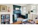 Cozy living room with a fireplace, wood floors and decor at 710 N Spring St, Greenfield, IN 46140